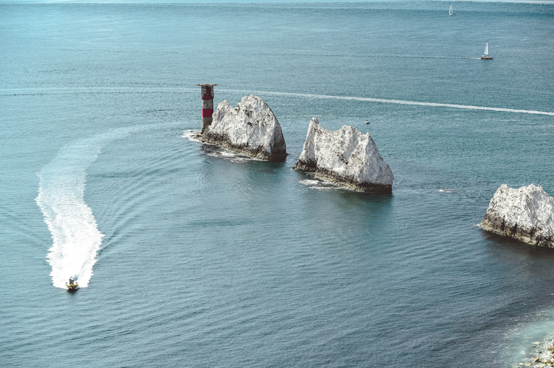 Pleasure boat cruises past The Needles